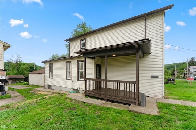 1802 Chester Ave, Wellsville, OH 43968 - rear view of property featuring a yard and covered porch