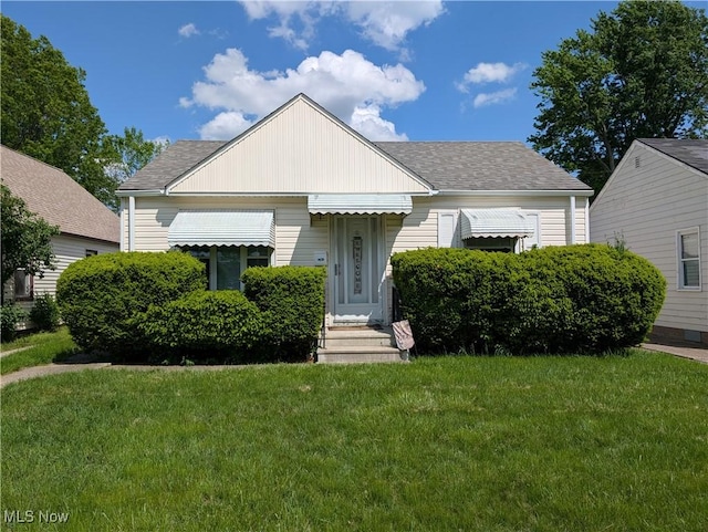 4625 W 147th St, Cleveland, OH 44135 - bungalow featuring a front yard, a shingled roof, and entry steps