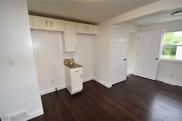429 N Osborn Ave, Youngstown, OH 44509 - kitchen with dark wood-style flooring, white cabinets, and baseboards