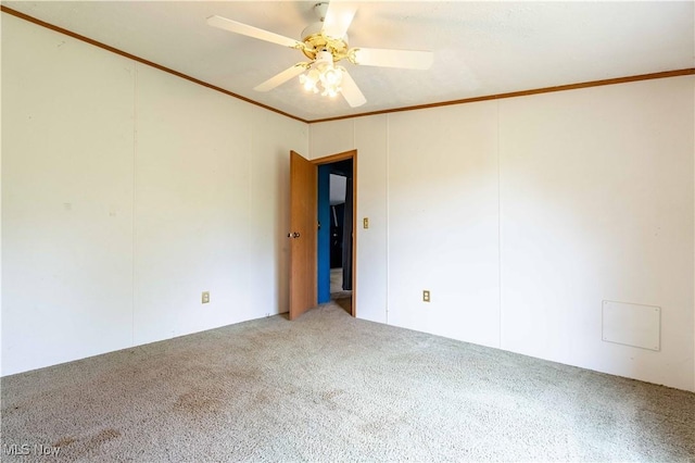 5240 Chalon Rd SW, Carrollton, OH 44615 - carpeted spare room with ornamental molding and ceiling fan