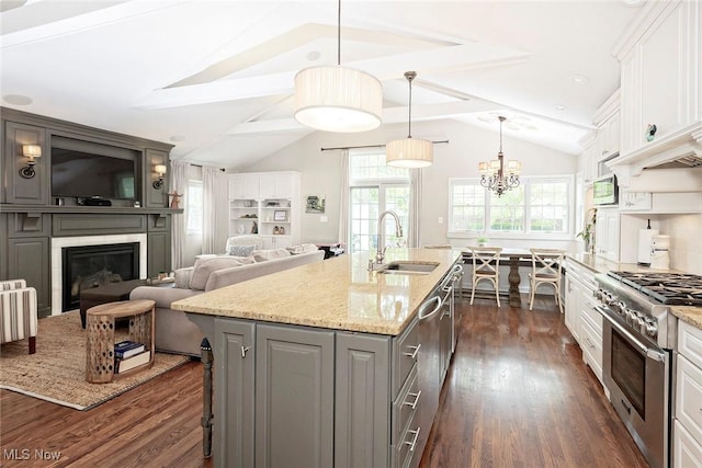 4168 Hadleigh Rd, University Heights, OH 44118 - kitchen featuring appliances with stainless steel finishes, gray cabinetry, a sink, dark wood-type flooring, and plenty of natural light