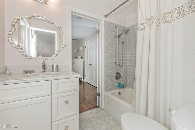 4168 Hadleigh Rd, University Heights, OH 44118 - bathroom with toilet, shower / bath combo with shower curtain, and vanity