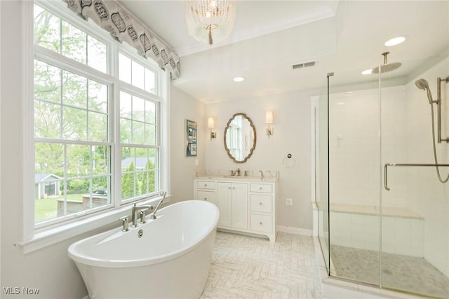 4168 Hadleigh Rd, University Heights, OH 44118 - bathroom with a stall shower, a freestanding bath, vanity, baseboards, and recessed lighting