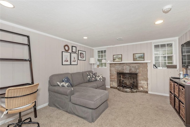 4168 Hadleigh Rd, University Heights, OH 44118 - carpeted living area featuring a stone fireplace, crown molding, recessed lighting, baseboards, and a textured ceiling