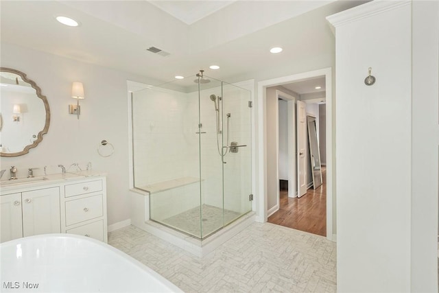 4168 Hadleigh Rd, University Heights, OH 44118 - full bathroom with a shower stall, recessed lighting, baseboards, a soaking tub, and vanity
