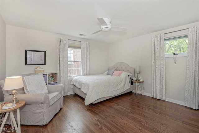 4168 Hadleigh Rd, University Heights, OH 44118 - bedroom with multiple windows, wood finished floors, baseboards, and a ceiling fan