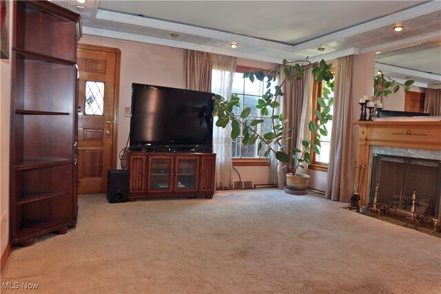 carpeted living room with a high end fireplace and crown molding