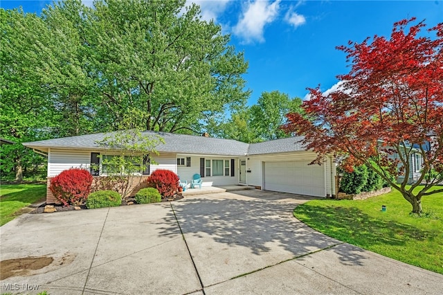 21494 Mastick Rd, Fairview Park, OH 44126 - ranch-style home with a garage, concrete driveway, a front lawn, and a shingled roof