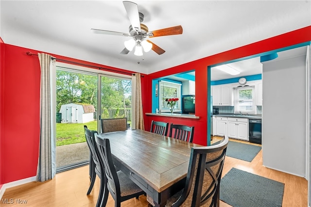 21494 Mastick Rd, Fairview Park, OH 44126 - dining space with plenty of natural light, ceiling fan, and light wood-style flooring