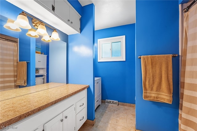 21494 Mastick Rd, Fairview Park, OH 44126 - bathroom featuring vanity, curtained shower, tile patterned floors, and baseboards
