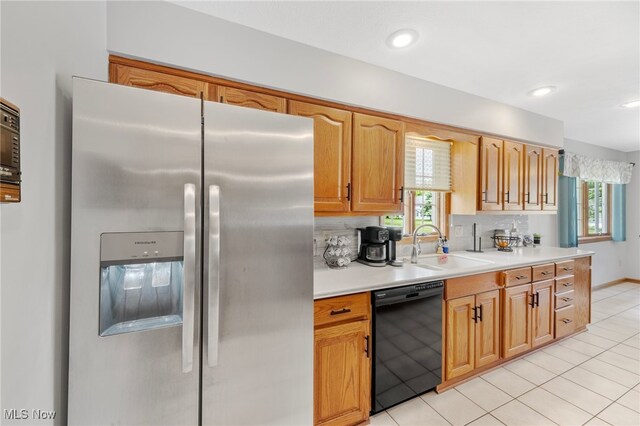 218 Tanglewood Dr, Dalton, OH 44618 - kitchen featuring stainless steel refrigerator with ice dispenser, black dishwasher, a sink, and plenty of natural light