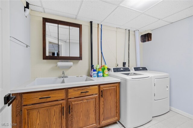 218 Tanglewood Dr, Dalton, OH 44618 - clothes washing area with independent washer and dryer, cabinet space, and baseboards