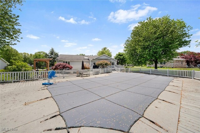 218 Tanglewood Dr, Dalton, OH 44618 - view of pool featuring fence and a patio