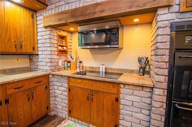 45 S Ridge Dr, Martins Ferry, OH 43935 - kitchen featuring black electric stovetop, brown cabinetry, dark wood-style flooring, and brick wall