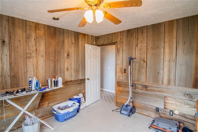 45 S Ridge Dr, Martins Ferry, OH 43935 - miscellaneous room with wood walls, ceiling fan, carpet flooring, and a textured ceiling