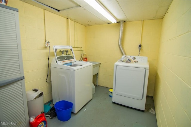 45 S Ridge Dr, Martins Ferry, OH 43935 - clothes washing area featuring washer and dryer and concrete block wall