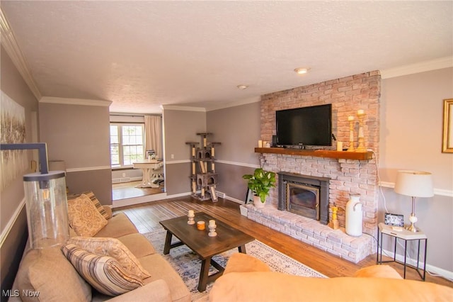 45 S Ridge Dr, Martins Ferry, OH 43935 - living area with wood finished floors, a brick fireplace, baseboards, crown molding, and a textured ceiling