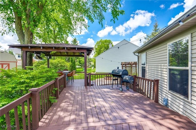 deck featuring a grill and a gazebo