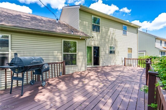 wooden deck with grilling area