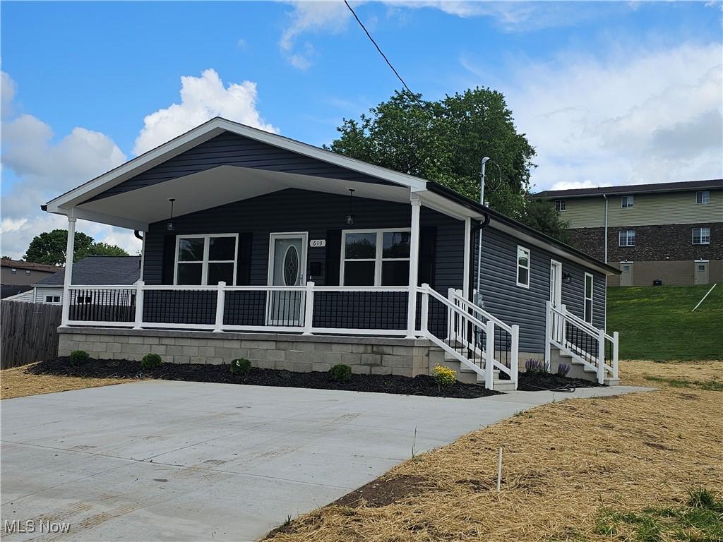 613 21st St, Vienna, WV 26105 - view of front of home with a porch