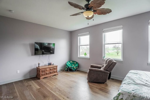 7841 State St NE, Louisville, OH 44641 - bedroom with wood finished floors, baseboards, and a ceiling fan