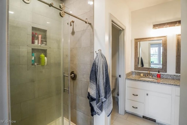 7841 State St NE, Louisville, OH 44641 - full bathroom with a shower stall, toilet, and tile patterned floors