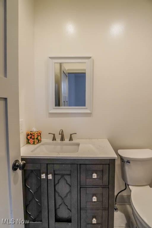 7841 State St NE, Louisville, OH 44641 - bathroom with vanity and toilet