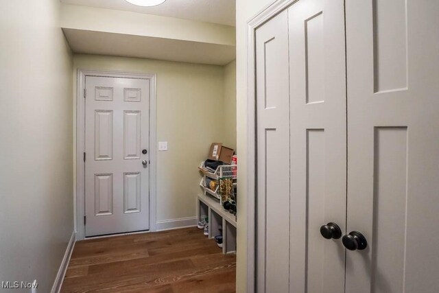 7841 State St NE, Louisville, OH 44641 - mudroom with dark wood finished floors and baseboards