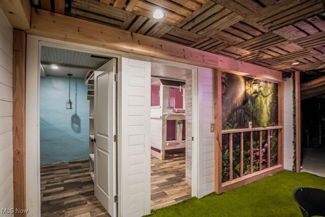 7841 State St NE, Louisville, OH 44641 - corridor featuring wood ceiling, wooden walls, and wood finished floors