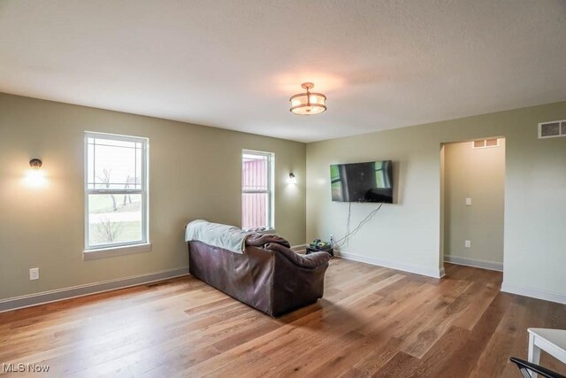 7841 State St NE, Louisville, OH 44641 - living room with wood finished floors and baseboards