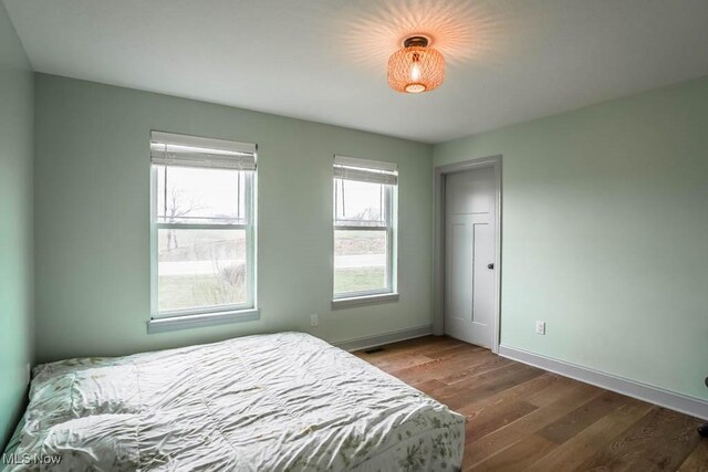 7841 State St NE, Louisville, OH 44641 - bedroom with wood finished floors and baseboards