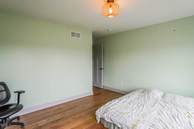 7841 State St NE, Louisville, OH 44641 - bedroom with wood finished floors and baseboards