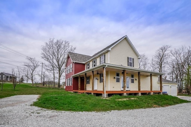7841 State St NE, Louisville, OH 44641 - farmhouse inspired home featuring a porch, a front yard, and brick siding