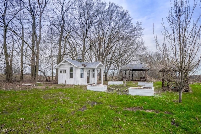 7841 State St NE, Louisville, OH 44641 - view of green lawn with an outbuilding