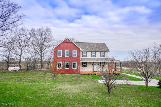 7841 State St NE, Louisville, OH 44641 - view of front of house featuring a front lawn, a deck, and a shingled roof
