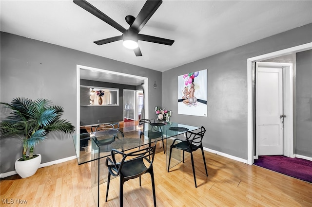 3741 E 146th St, Cleveland, OH 44120 - dining room with ceiling fan, light wood-style floors, and baseboards