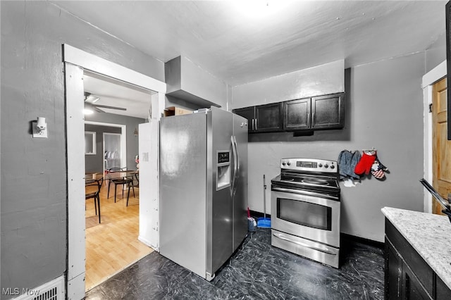 3741 E 146th St, Cleveland, OH 44120 - kitchen featuring appliances with stainless steel finishes, ceiling fan, dark cabinets, and light countertops