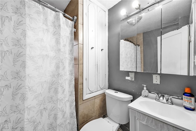 3741 E 146th St, Cleveland, OH 44120 - full bathroom featuring toilet, vanity, and a shower with shower curtain