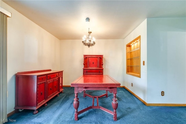 dining room featuring dark carpet, a chandelier, and baseboards