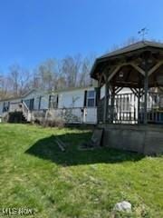 17607 Halleys Ridge Rd, Pleasant City, OH 43772 - back of house featuring a lawn