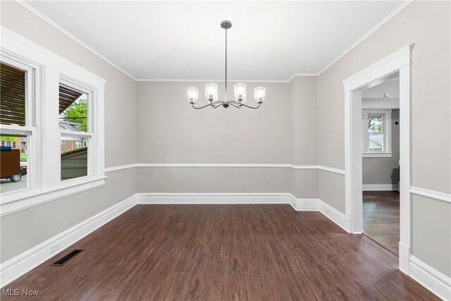 453 Saint Leger Ave, Akron, OH 44305 - empty room featuring dark wood finished floors, a chandelier, plenty of natural light, baseboards, and ornamental molding