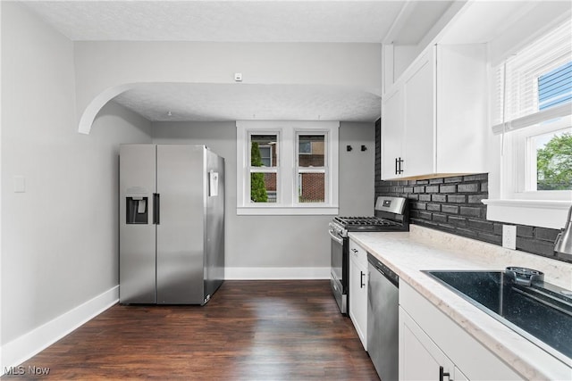 453 Saint Leger Ave, Akron, OH 44305 - kitchen with appliances with stainless steel finishes, baseboards, white cabinetry, and a textured ceiling