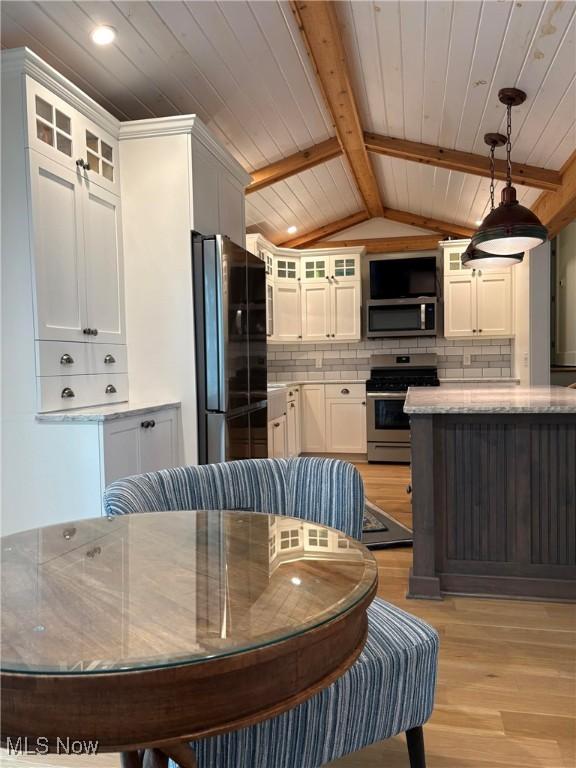 3569 N Karwood Dr, Port Clinton, OH 43452 - kitchen featuring stainless steel appliances, light wood-style floors, white cabinets, wood ceiling, and decorative backsplash