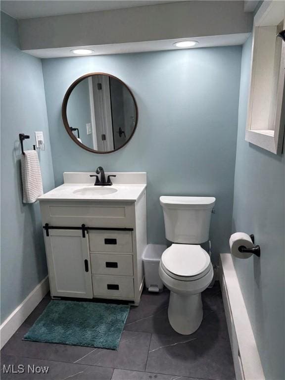 3569 N Karwood Dr, Port Clinton, OH 43452 - half bathroom with vanity, toilet, tile patterned floors, recessed lighting, and baseboards