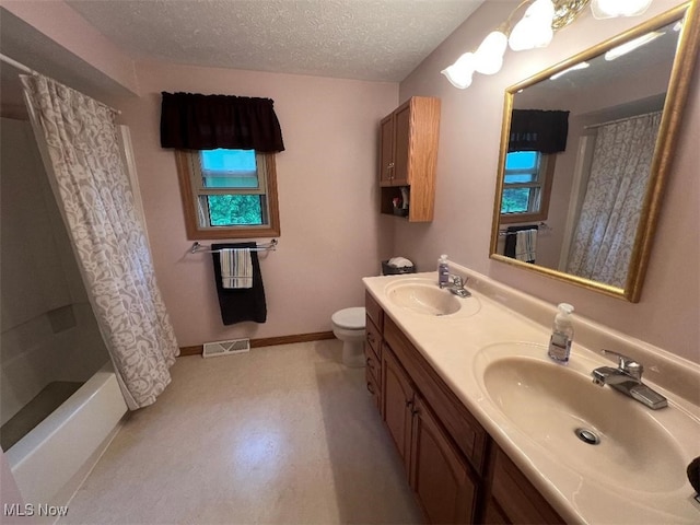 2165 Stony Hill Rd, Hinckley, OH 44233 - full bathroom with double vanity, toilet, a textured ceiling, shower / tub combo, and baseboards