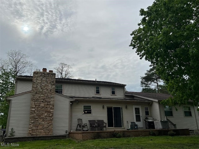 2165 Stony Hill Rd, Hinckley, OH 44233 - back of property featuring a yard and a chimney