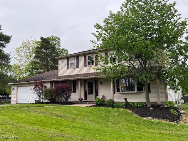 2165 Stony Hill Rd, Hinckley, OH 44233 - view of front of house featuring a front lawn, a garage, cooling unit, and a porch