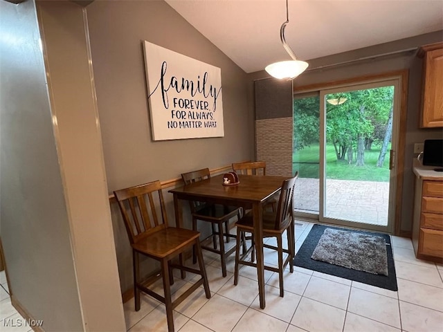 2165 Stony Hill Rd, Hinckley, OH 44233 - dining area featuring light tile patterned floors and lofted ceiling