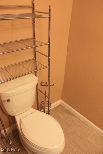 55960 National Rd, Bridgeport, OH 43912 - bathroom featuring toilet and baseboards