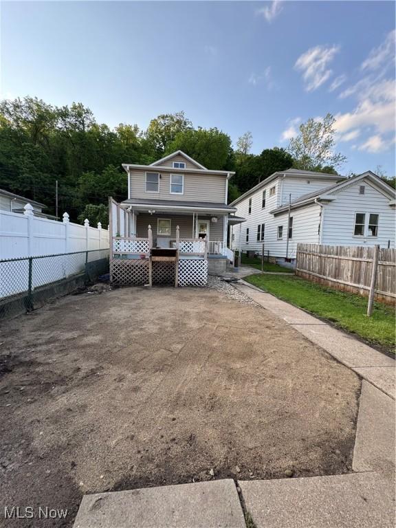 55960 National Rd, Bridgeport, OH 43912 - view of front of house with a porch and fence